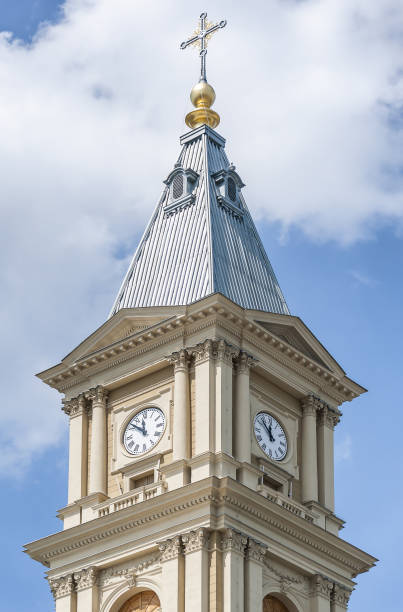 istock Baroque church tower with cross and clock 646608372