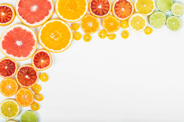 istock Colorful fresh citrus fruit on white background. Orange, tangerine, lime, blood orange, grapefruit. Fruit background. Summer food concept. Flat lay, top view, copy space 646614882