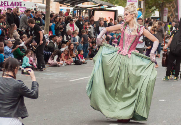 Performers - Adelaide Fringe 2017 ADELAIDE, AU - FEB 18, 2017: Over 80 floats and 1500 Fringe artists entertain crowds at the opening parade for the 2017 Adelaide Fringe, the second largest annual arts festival in the world after the Edinburgh Fringe Festival. This year`s theme, `Mythical Wonderland'. curtseying stock pictures, royalty-free photos & images