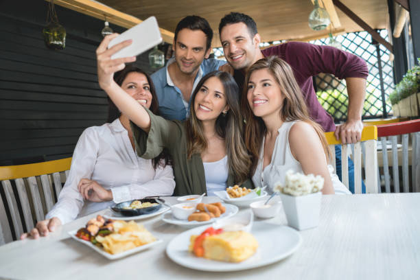 istock Friends taking a selfie at a restaurant 646624198