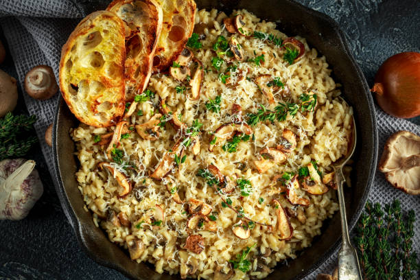 istock Mushroom Risotto in iron pan with herbs and parmesan cheese 646651310