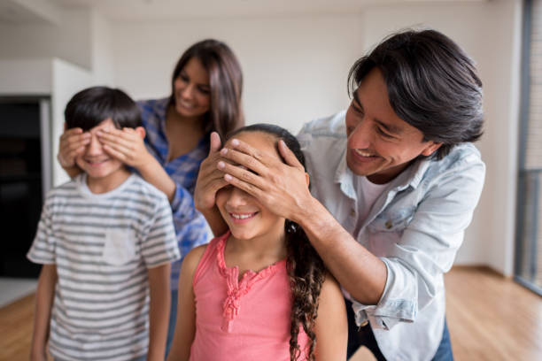istock Parents surprising kids at home 646688600