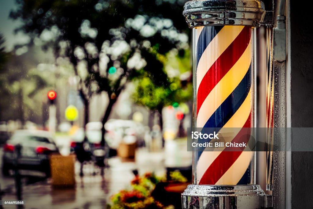 Barber Pole Rain collecting on a barber shop pole in southern California. Barber Shop Stock Photo