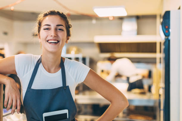 istock Beautiful girl with digital tablet working in the bakery 646714518