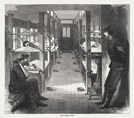 Interior of an Union hospital train during the American Civil War. Wood engraving, published in 1865.