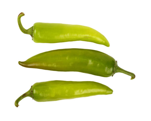 istock Green fresh jalapeno peppers close up on white 646720400