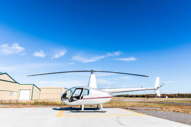 istock Helicopter side view at heliport 646726550