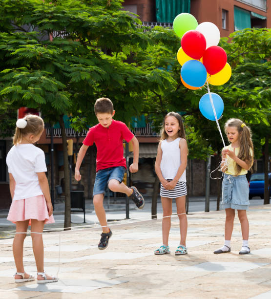 istock Small kids playing with jumping rope 646726660