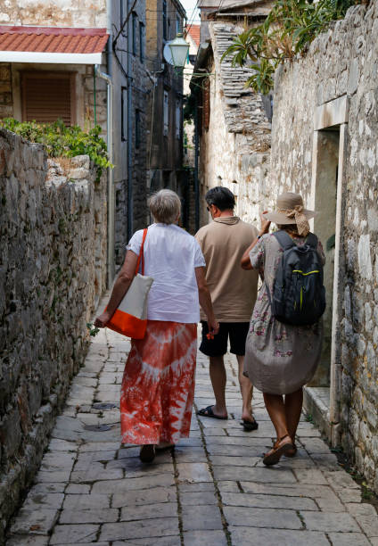 istock Tourists visiting beautiful mediterranean town 646727168