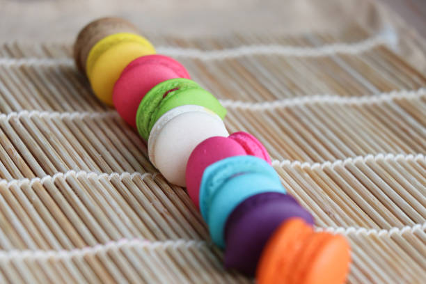 istock Sweet candy macarons on bamboo mat delicious and colorful 646730054