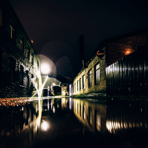 istock Dark backstreet reflected in puddle. Tallinn. 646731060