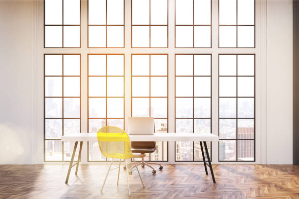 istock Workplace with yellow chair and windows; toned 646733496