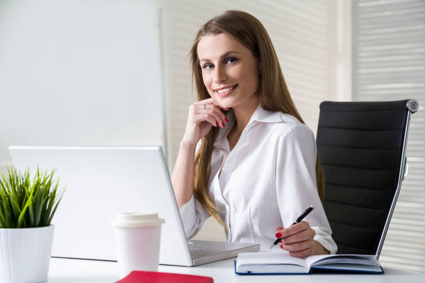 istock Smiling businesswoman in office 646733714