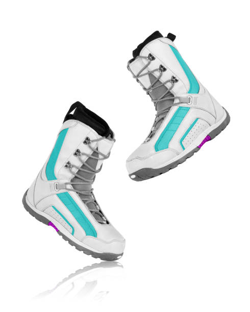 istock snowboard boots are frozen in the fall on a white background 646734536