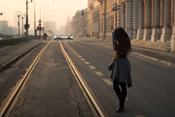 istock Girl looking back on the road 646736952