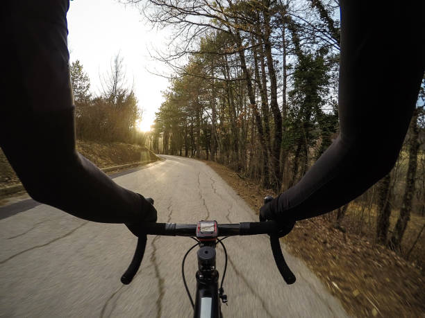 istock Cycling at sunset. Personal perspective 646747382