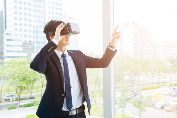 istock Young businessman trying vr goggles 646750414