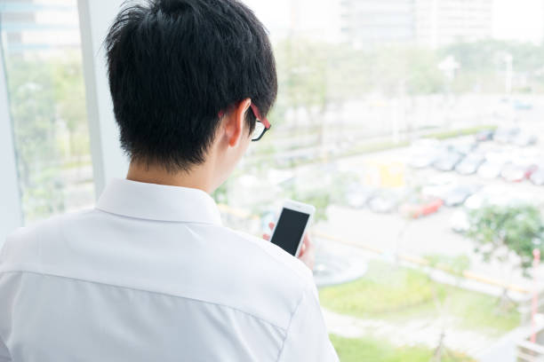 istock Close up of a man using mobile smart phone 646750444