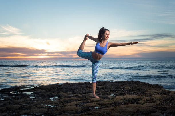 istock Hispanic Women Doing Yoga On The Ocean 646754052