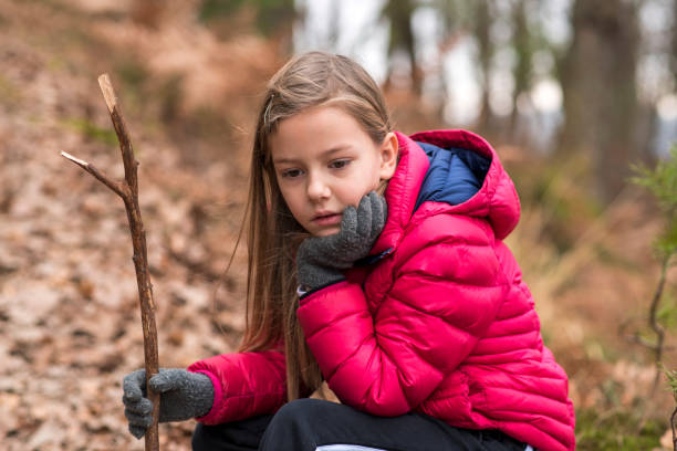 istock Little girl resting in a forest 646760658