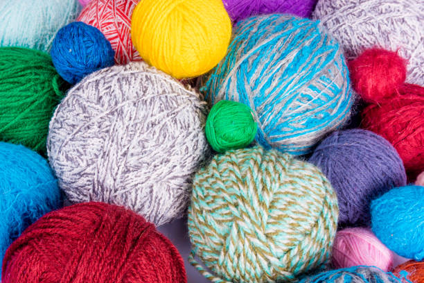 istock wool yarn ball. Colorful threads for needlework. Colorful fabric texture background 646774364