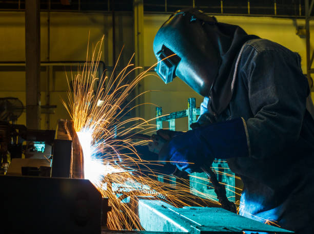 istock Worker,welding in a car factory 646793608