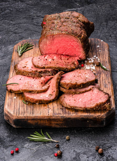 istock Roast beef on cutting board with salt and pepper. 646797006