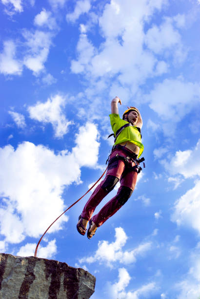 Soweto, South Africa - August 8, 2015: A person bungee jumps off of the cooling towers of the decommisioned Orlando Power Station in Soweto. For 56 years the plant supplied Johannesburg with electricity.