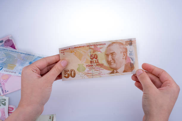 istock Hand holding Turksh Lira banknote  in hand 646804748