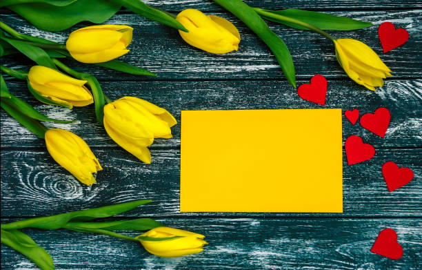 istock Women's Day greeting card .Flat lay with yellow tulips. 646804950