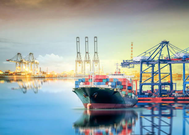 istock International Container Cargo ship with working crane bridge in seaport 646809336