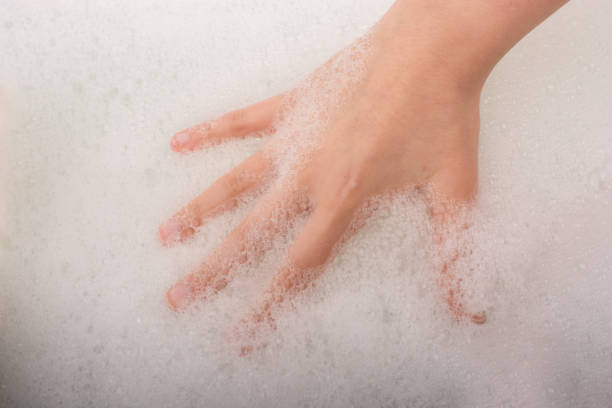 istock Child washing hands  in foam 646812080