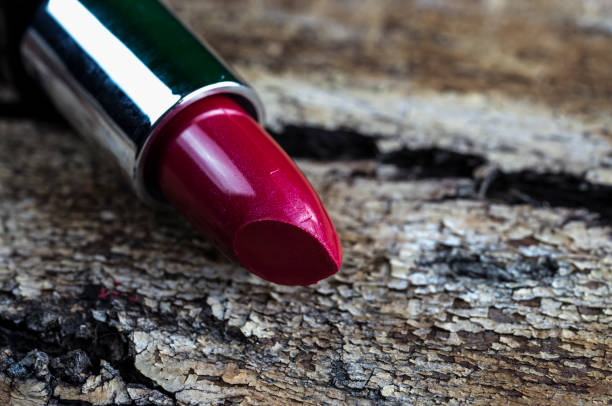 istock Red Lipstick on vintage wood 646813144