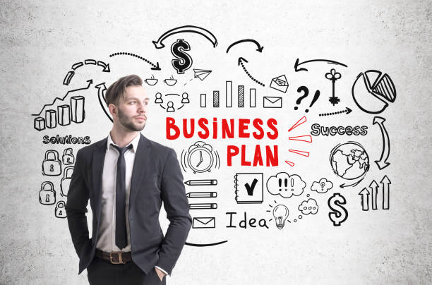 istock Confident businessman and business plan icons 646824402