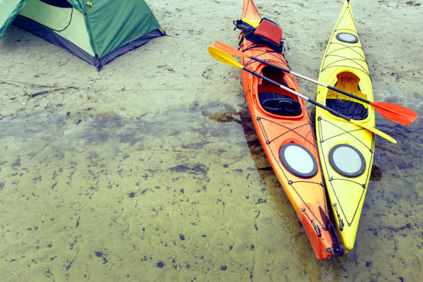 istock Camping with kayaks on the river bank. 646826860