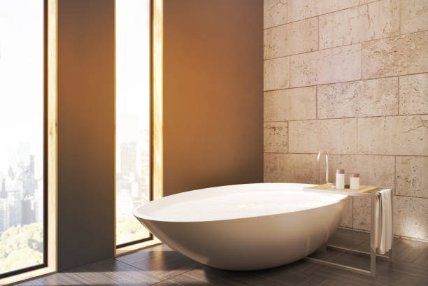 istock Bathroom with white tub and cityscape 646826882