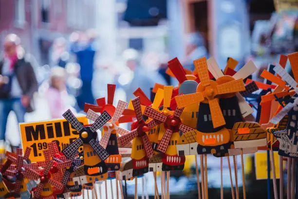 Photo of Amsterdam walk. Flowers market. wooden windmill souvenir from Amsterdam