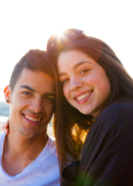 istock Young couple hugging in the beach 646831712