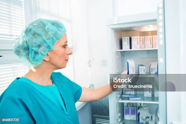 Researcher With Samples Stock Photo - Download Image Now - Refrigerator, Medicine, Healthcare And Medicine