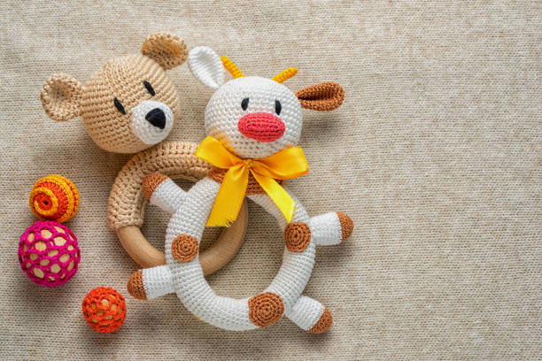 istock knitted rattles for toddlers and copy space. 646836128