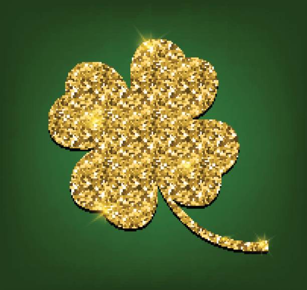 istock Four leaf clover made of gold sand, isolated on green background. 646839506