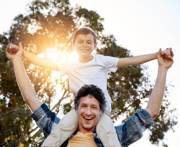 istock Strong fatherly figure raising a strong little boy 646840356