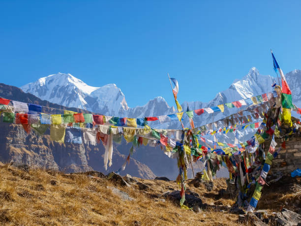 istock Mountain range on the background of prayer flags in Himalayas 646844168