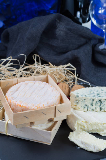 istock French red wine and soft cheeses on black stone platter 646845146