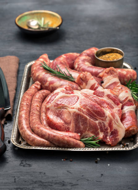 istock Full iron tray raw meat grill on dark stone surface 646847392