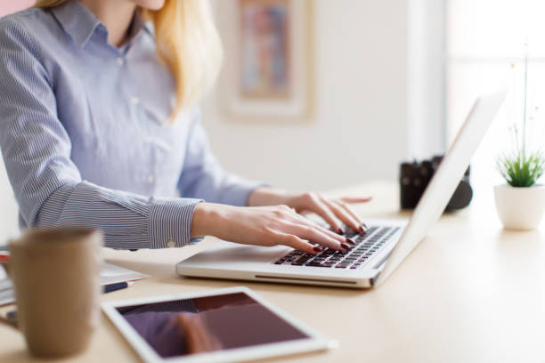 istock Close up of woman using laptop 646847970