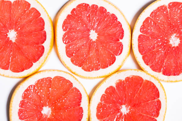istock Texture of a ripe grapefruit slice, closeup 646848132