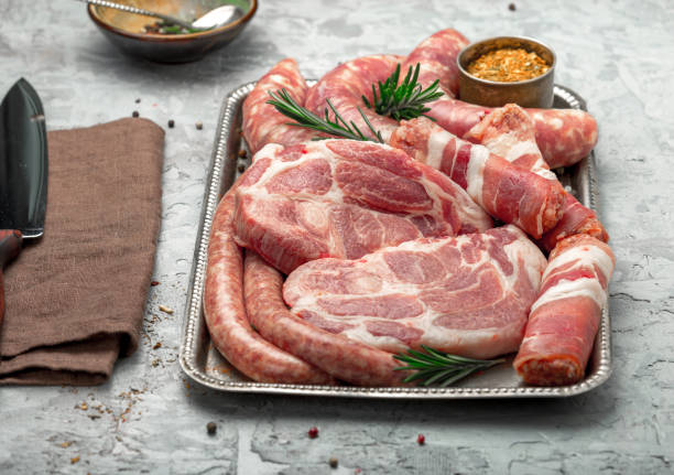 istock Set of different meat products on an iron tray on a light surface 646848354