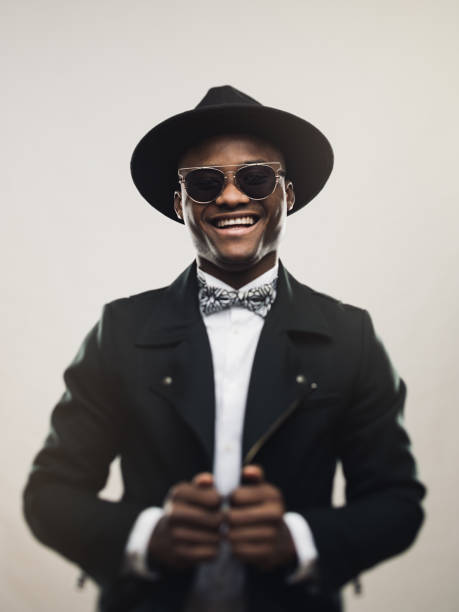 istock Vintage young man wearing black suit and hat 646851888