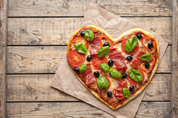 istock Pizza heart shaped love concept Valentine's Day symbol restaurant romantic dinner 646853182
